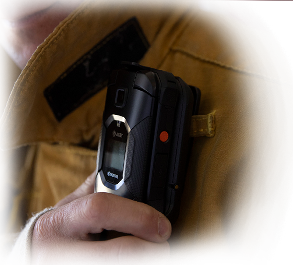 A gloved hand holding the DuraXE Epic phone